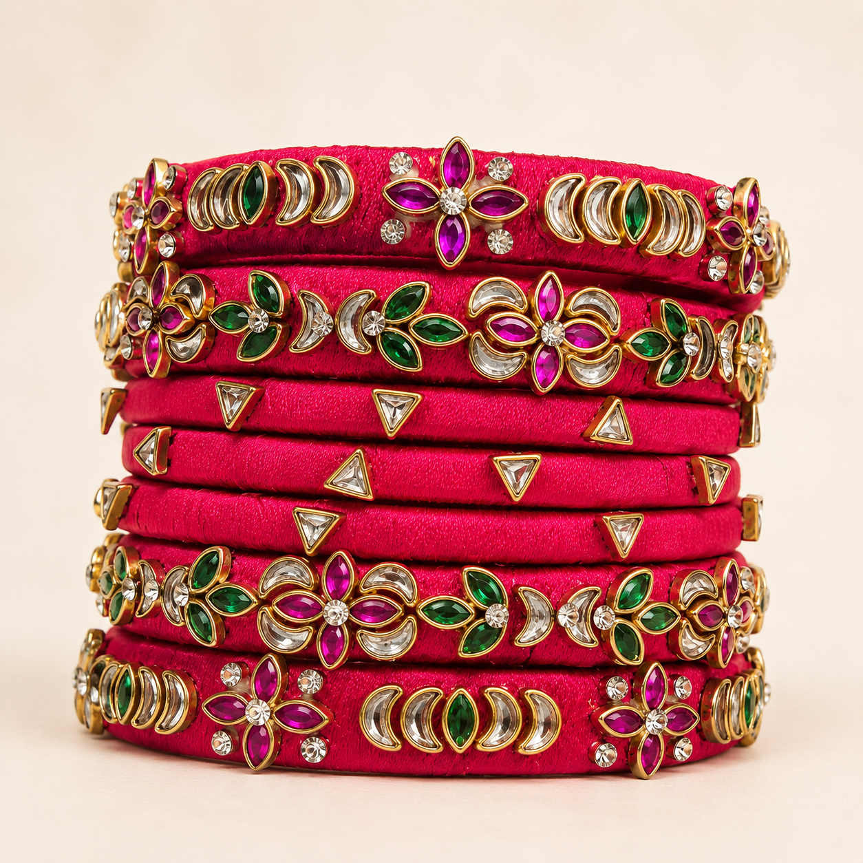 Close-up of a magenta festive silk thread bangle set.